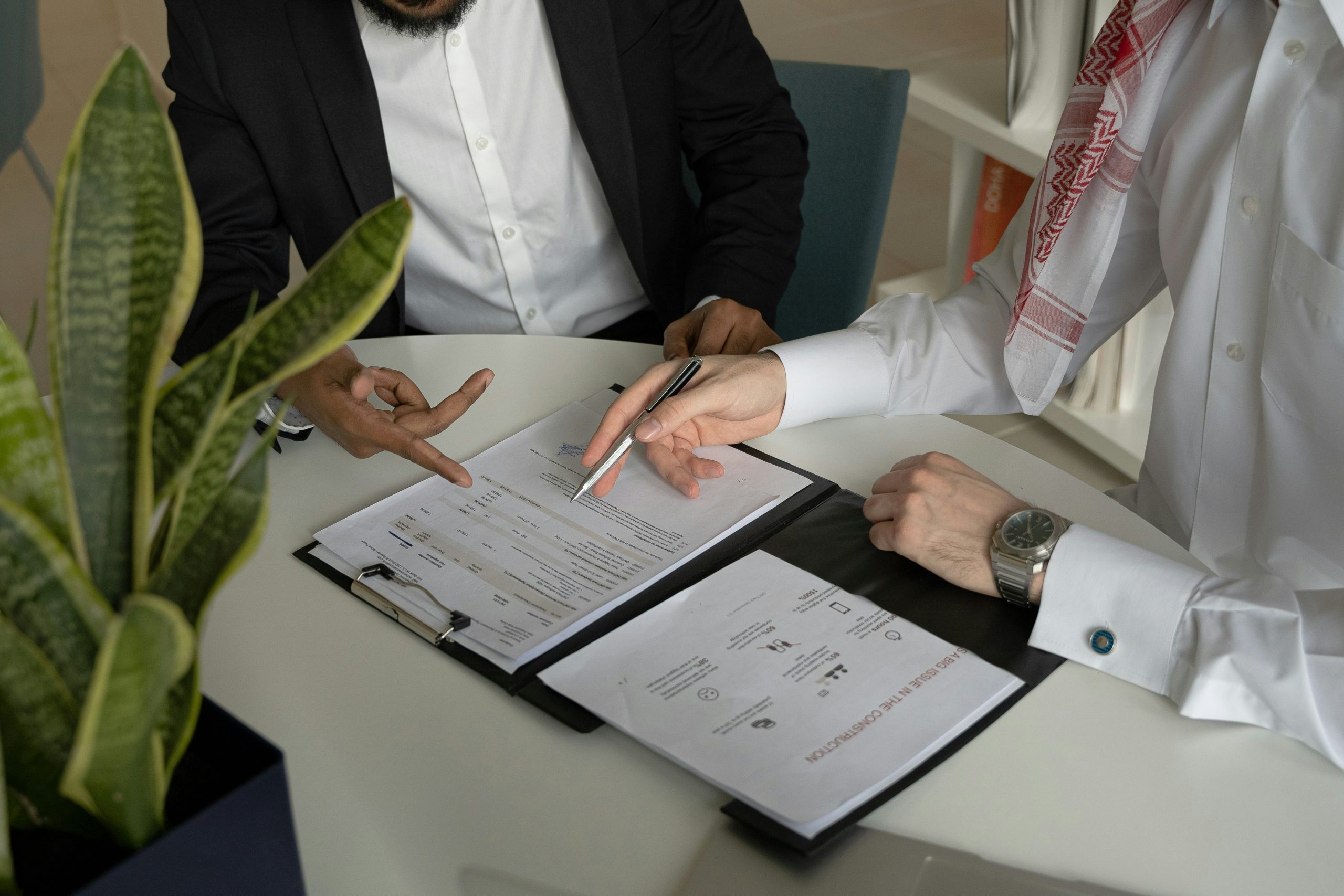Business owner signing a primary supplier contract to lock in pricing