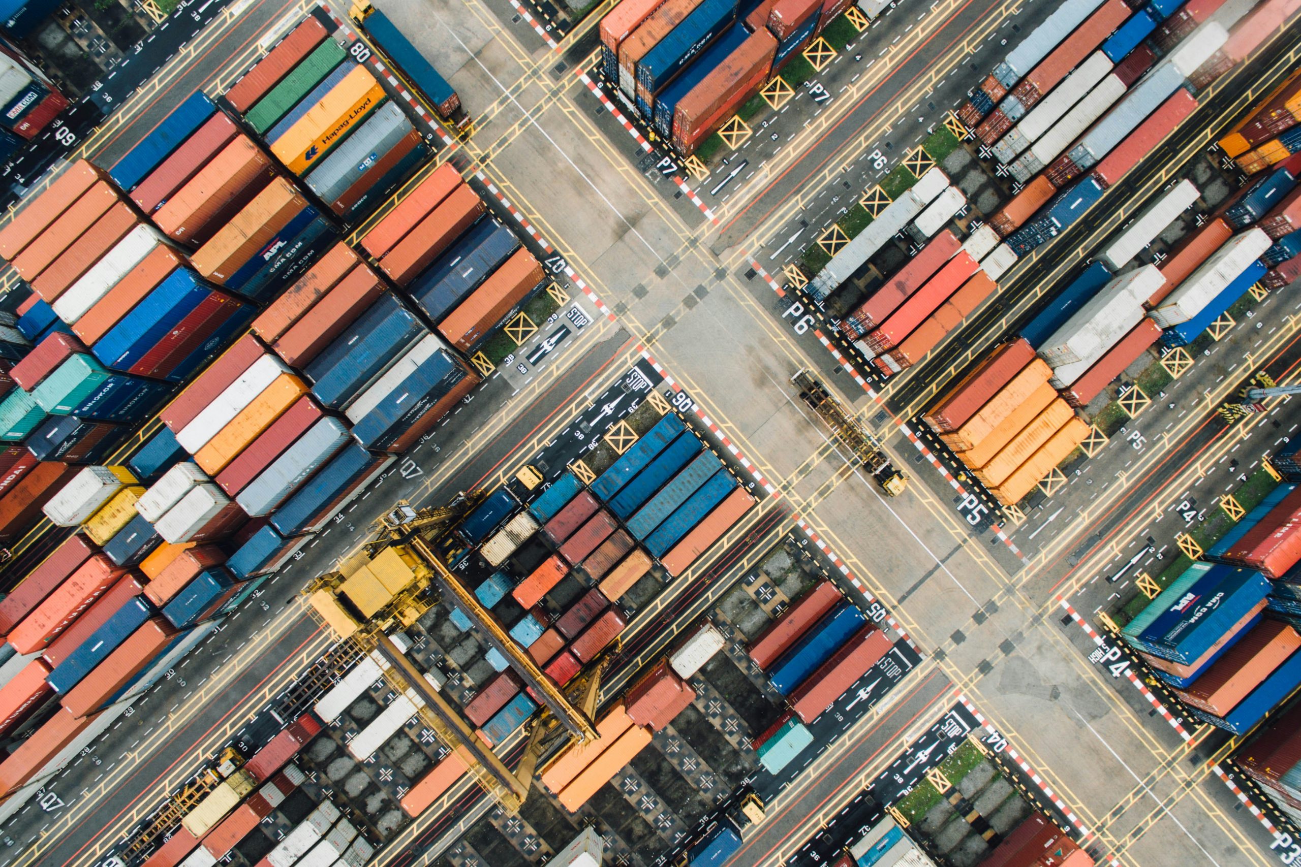 Rows of shipping containers representing diversified product sourcing channels